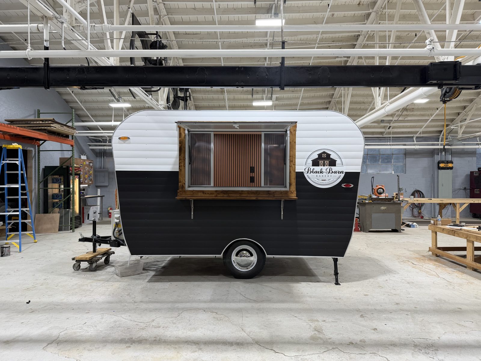 Black Barn Bakery trailer in the shop with the service window open