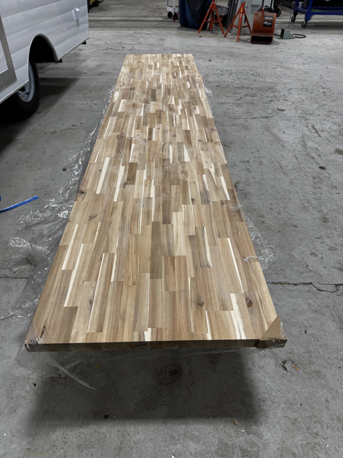 Butcher-block counter and open service window inside a renovated trailer